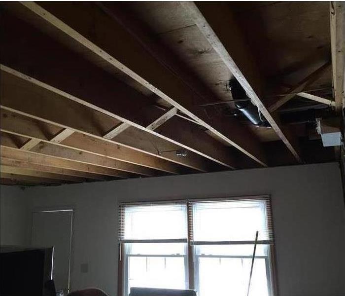 Ceiling repaired after a storm tore it open