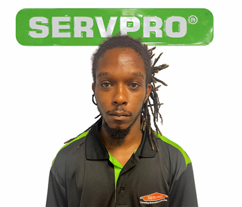 Josh, male, SERVPRO employee, cut out, against a white background, SERVPRO green sign above head