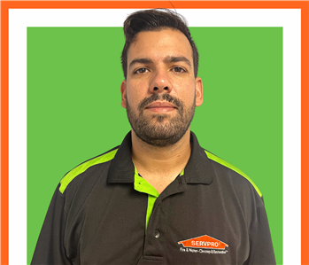 Andre, SERVPRO employee, cut out and set against a green backdrop