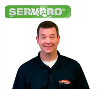 Brian Bell for SERVPRO photo on white wall